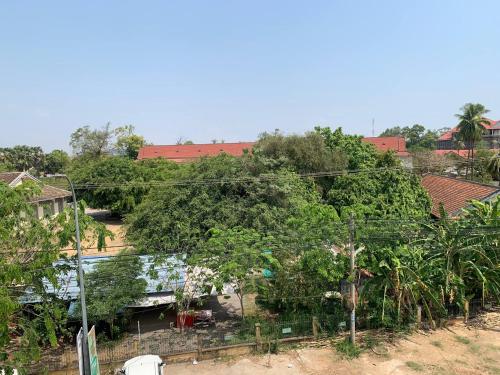 an overhead view of a village with trees and houses at Ditar Guest House D in Battambang