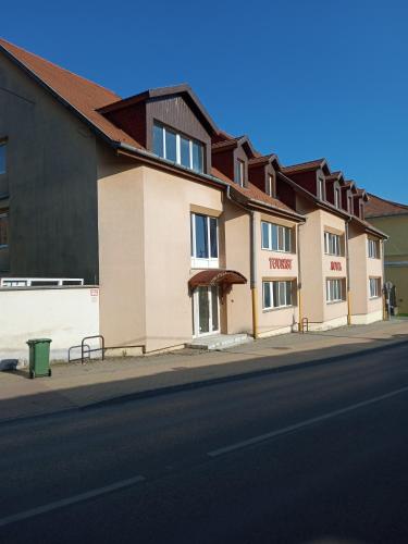 a row of buildings on the side of a street at Hotel Merlot in Eger