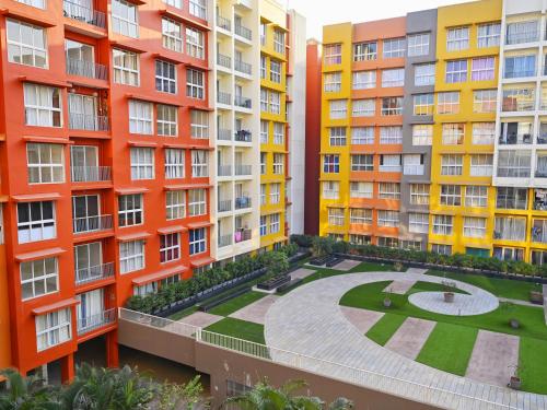 an apartment complex with colourful buildings at No Fixed Address in Marmagao