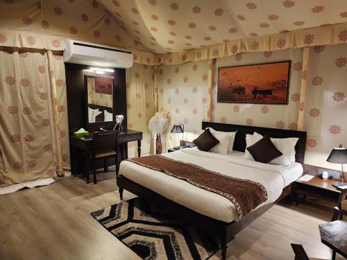 Voodi või voodid majutusasutuse Brahmaputra Retreat toas