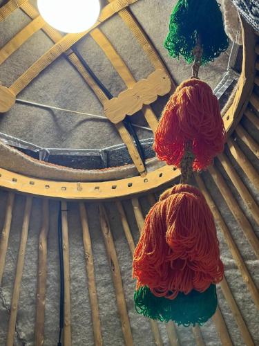 two balls of yarn sitting on top of a table at As A Nomad Naryn Ethno Complex in Naryn