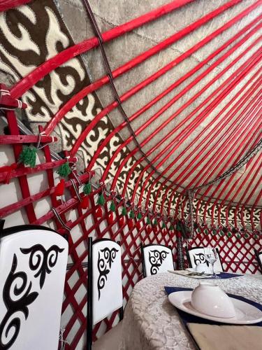 a table with a plate of food on top at As A Nomad Naryn Ethno Complex in Naryn