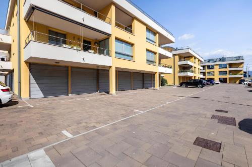 an empty parking lot in front of a building at Attico Riva Mare in Muggia