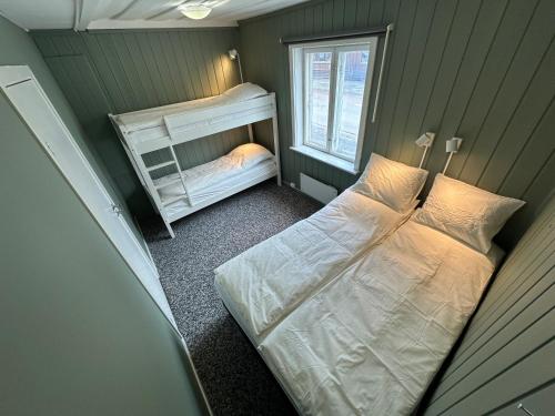 a bedroom with two bunk beds and a mirror at KM Rentals - Lillestrøm City - Private Rooms in Shared Apartment in Lillestrøm