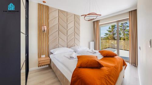 Postel nebo postele na pokoji v ubytování Pod Brzozami Apartamenty Gea Eco