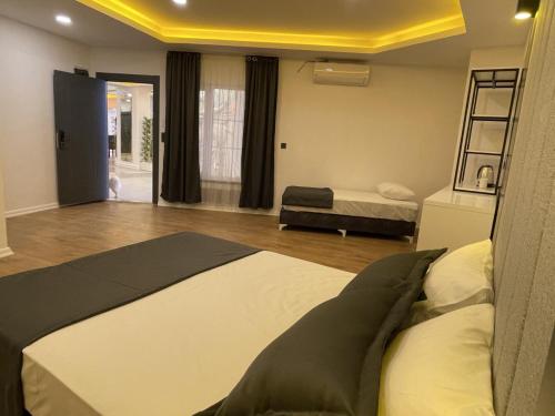 a bedroom with a bed and a room with a ladder at Mi Hotel Boutique in Antalya
