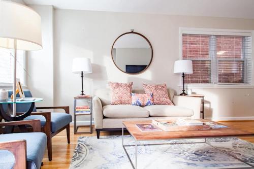 a living room with a couch and a table at Transit-Friendly Home Old Town Parking in Alexandria