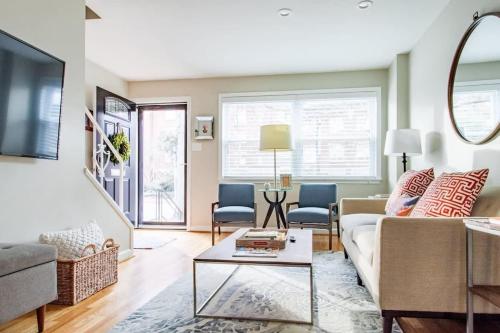 a living room with a couch and a table at Transit-Friendly Home Old Town Parking in Alexandria