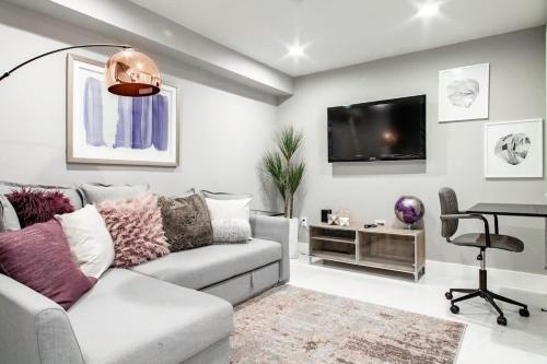 a living room with a couch and a table at Centrally-Located Well-Decorated Solar-Powered in Washington, D.C.