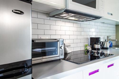a kitchen with a stainless steel counter top at Eastern Market Carriage house efficiency PRIVACY in Washington, D.C.