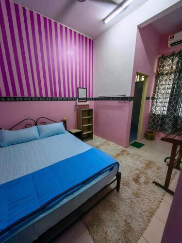 Katil atau katil-katil dalam bilik di Homestay Hitech Kulim Islam Guest Only