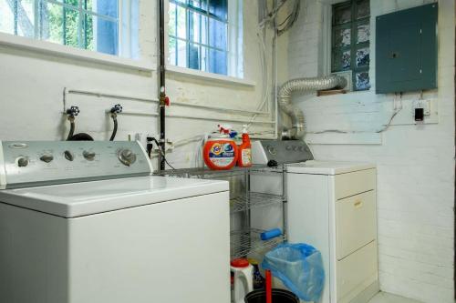 a kitchen with a sink and a dishwasher at A Classy Corner of DC Minutes walk to Dupont Circle in Washington