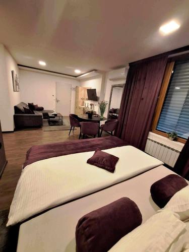 Arcobaleno Apartments & Roomsにあるベッド