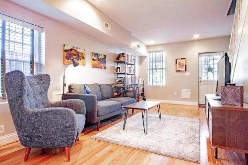a living room with a couch and a table at Family-friendly Home for travelers Near subway in Washington, D.C.