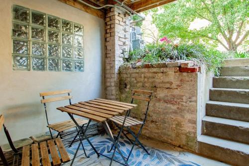 a picnic table and chairs on a porch with stairs at Over the Moon About C Adams Morgan METRO subway Rock Creek Park in Washington