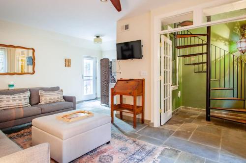 a living room with a couch and a table at H St Sanctuary Capitol Hill Carriage House in Washington, D.C.