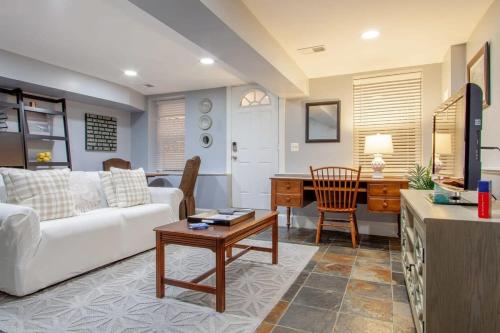 a living room with a white couch and a table at Delightful 1-BR Accommodations Nearby METRO in Washington, D.C.