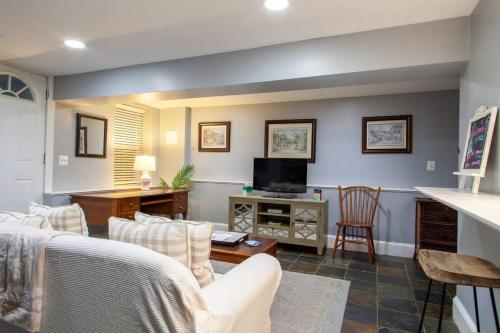 a living room with a couch and a tv at Delightful 1-BR Accommodations Nearby METRO in Washington, D.C.