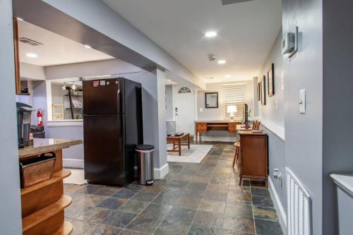 a kitchen with a black refrigerator and a table at Delightful 1-BR Accommodations Nearby METRO in Washington, D.C.