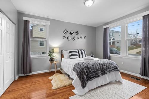 a bedroom with a bed and a window at Short Drive to Capitol Hill-Convenient MD Homestay in Capitol Heights