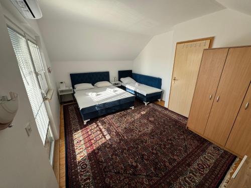 a small bedroom with a bed and a closet at Villa Gagula in Sarajevo