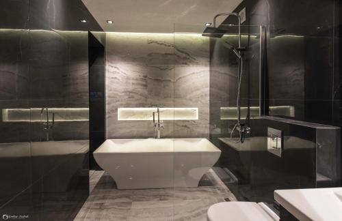 a bathroom with a sink and a toilet at Vera HOTEL-VILLA in Pristina