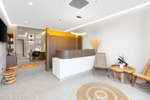 a lobby with chairs and a reception desk at Bali Star Resort Hotel in Balíon