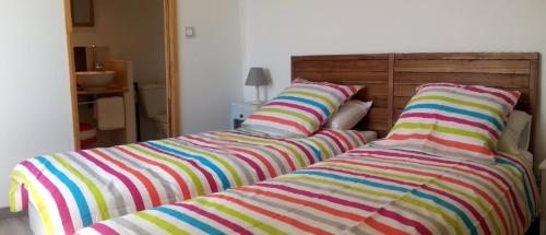 Cama o camas de una habitación en le sécadou chambres et table d'hôtes