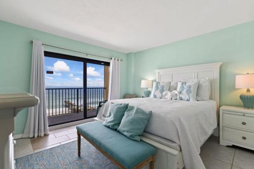 a bedroom with a bed with a view of the ocean at Breathtaking Ocean Views! Sunglow Resort 1002 by Brightwild in Daytona Beach Shores