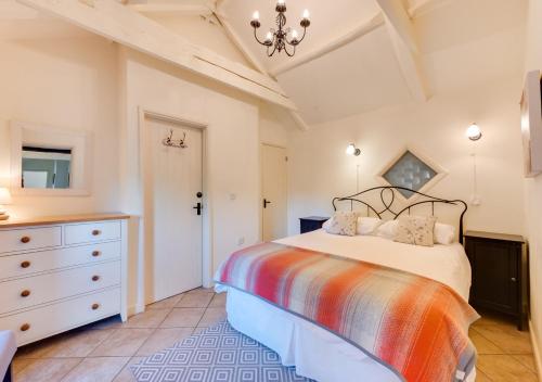 a bedroom with a large bed and a dresser at Remus in Larling