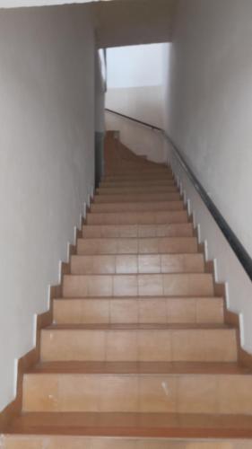 a staircase in a building with wooden floors at Aguascalientes feria nacional de San Marcos in Aguascalientes