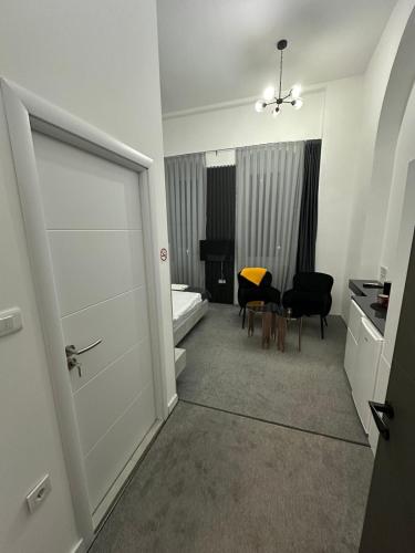 a room with a door and a room with a bedroom at Magnolija Apartments in Bitola