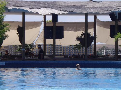 a person in the water in a swimming pool at Relaks w Marina Cape 88 in Aheloy