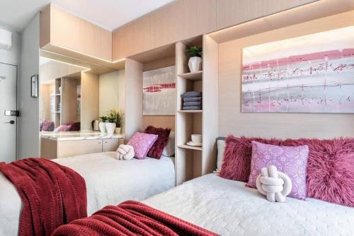 two beds in a room with pink and white at Private Triple Room in Sydney City Near TrainBus UTS DarHar&ICC&ChinaTown - ROOM ONLY in Sydney