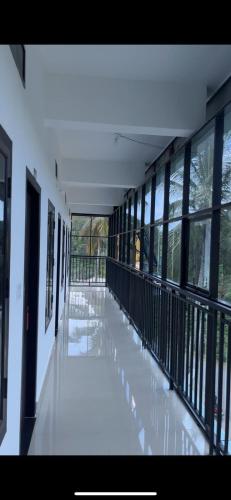 an empty hallway of a building with windows at EDASSERI ARCADE in Kalpetta