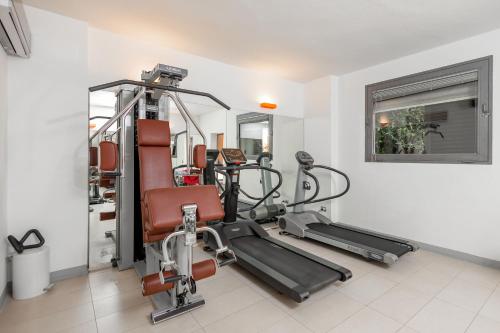 a gym with cardio equipment in a room at Residence Poggio Golf Chianti Firenze in Impruneta