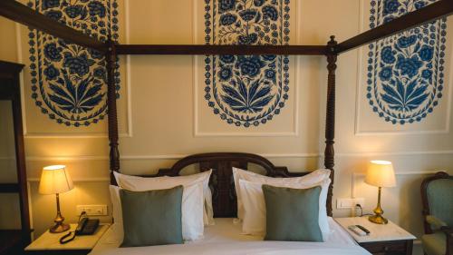 Ένα ή περισσότερα κρεβάτια σε δωμάτιο στο Hotel Naren Villa