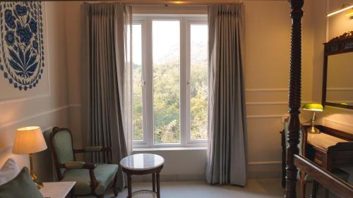 Ένα ή περισσότερα κρεβάτια σε δωμάτιο στο Hotel Naren Villa
