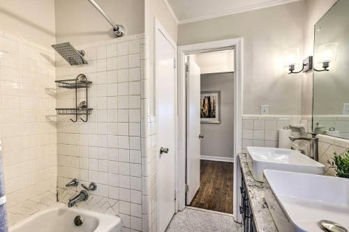 a white bathroom with two sinks and a shower at Southern Charm l 5BR l Sleeps 14 l A Location in Birmingham