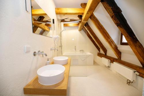 a bathroom with a toilet and a sink and a tub at Hotel Svambersky dum in Český Krumlov