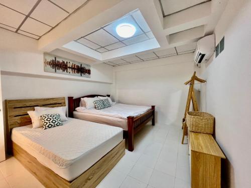 Katil atau katil-katil dalam bilik di Gao Check in Phala Beach Front