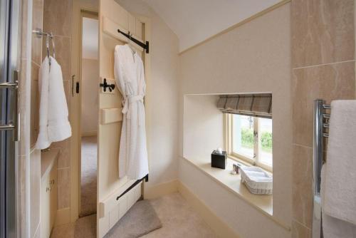 a bathroom with a shower and a window at Dryburgh Stirling One in Saint Boswells