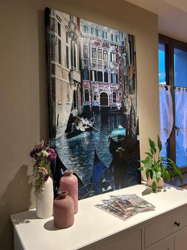a window with a picture of a canal at Antica Stazione in Guebwiller