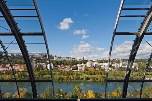 a view of a river from a bridge at Crowne Plaza Lyon - Cité Internationale in Lyon