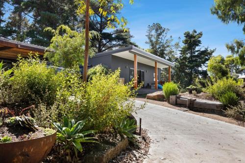 a house with a garden and a driveway at Bells Beach Escape - Secret Hideaway in Jan in Bellbrae
