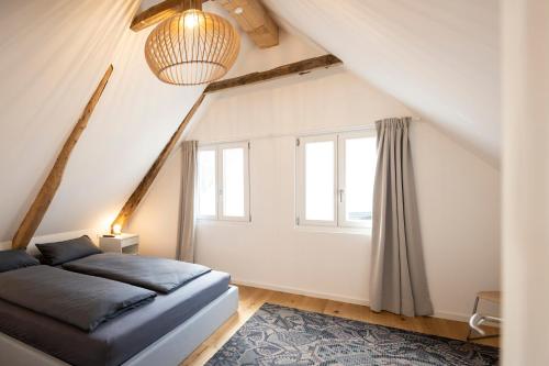 a bedroom with a bed and a window at Ferienwohnung Burgstübchen in Nordhorn