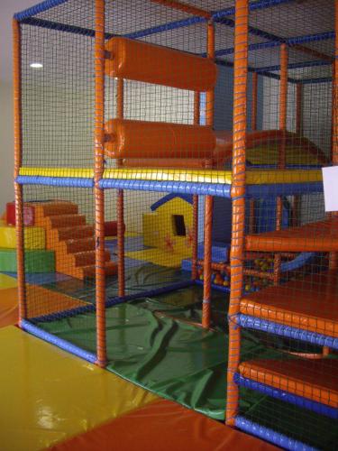 a cage with a wooden chair in a room at Relaks w Marina Cape 88 in Aheloy