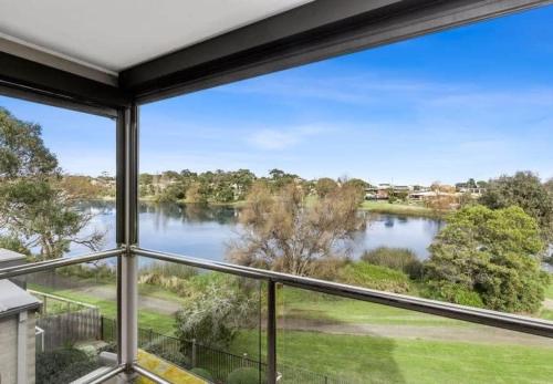 a view of a lake from a house window at Riviera Lakeside with uninterrupted Water Views in Ocean Grove
