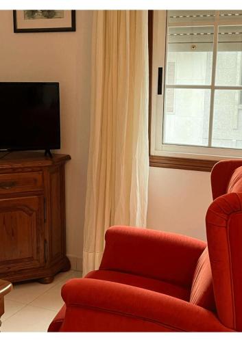 TV a/nebo společenská místnost v ubytování Apartamentos Deza- Playa Silgar