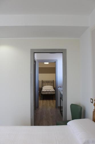 a view of a bedroom with a bed in the background at B&B Villa Verona Bike in Buttapietra